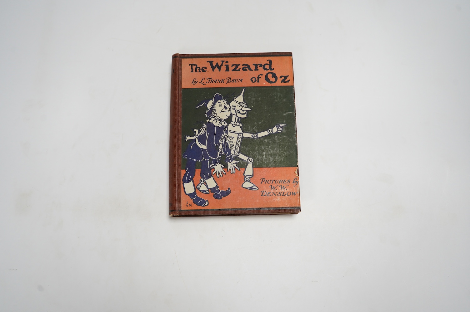 Baum, Frank - The Wizard of Oz, illustrated by W.W. Denslow, 12mo, pictorial front board over red cloth, Hutchinson & Co, London, [1926].